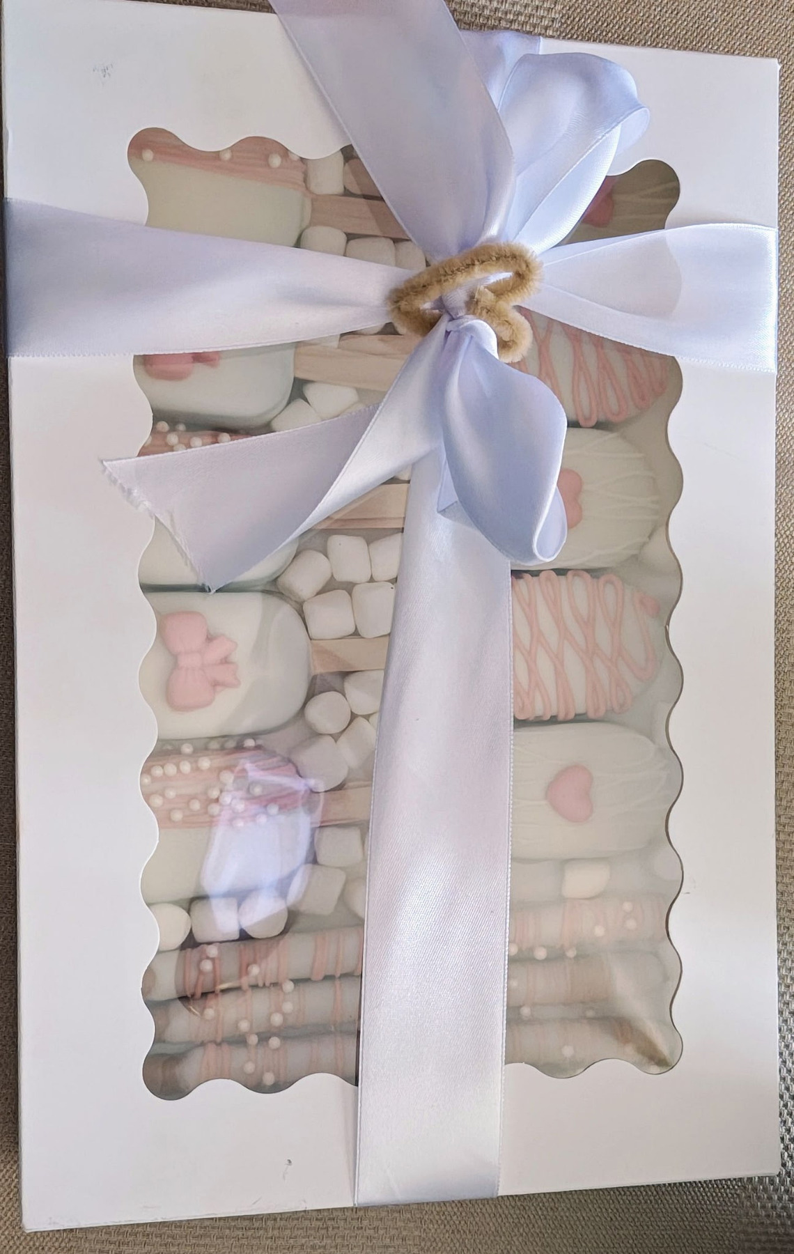 Ribbon-wrapped custom treat gift box by Katalina